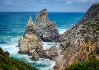 You can see how massive the rock formations are compared to the people walking along the beach below