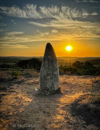 Menhir de Padrão in Raposeira at sunrise.