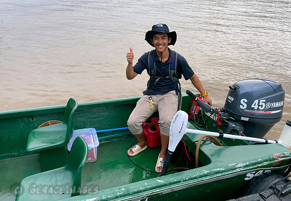 Our boatsman Saipul and our boat with additional electric motor.