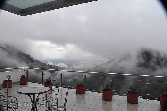 The fog begins to clear out high above Quito. View is from the patio of our hotel room.