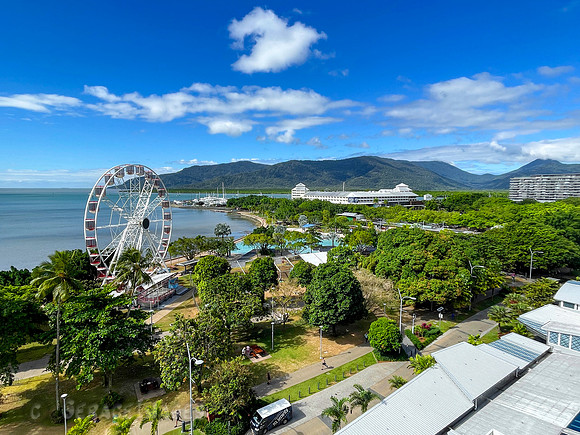 Hotel room view of the Esplanade waterfront and the Atherton Tablelands Mountains in the background.