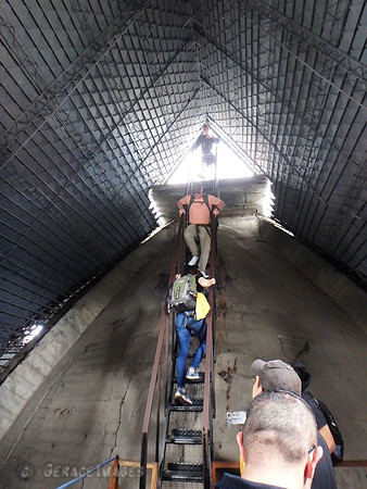 people coming down from the viewing platform to the catwalk.