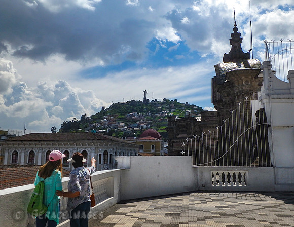 View in Old Town of Pancito, a madonna statue with wings up on a hillside.
